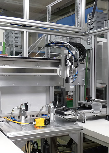 Automation line with dispensing head for bead lubrication